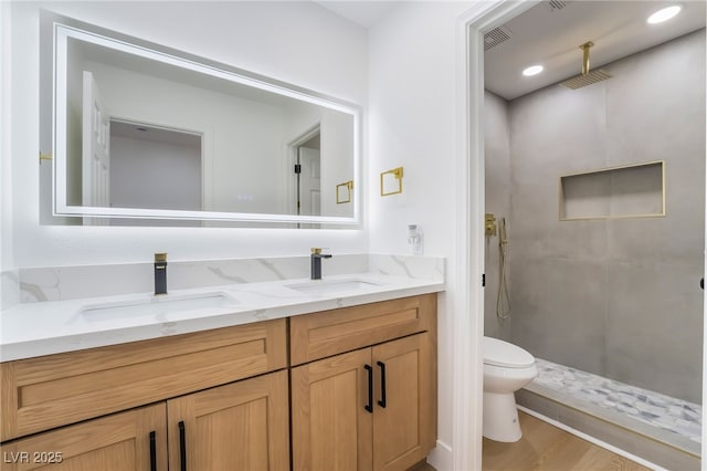529 Fork Mesa Ct, Henderson, NV 89015 - full bathroom with toilet, a stall shower, double vanity, and wood finished floors