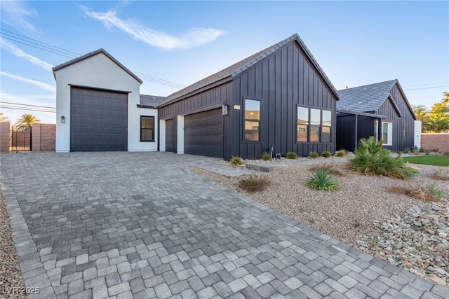 view of front facade featuring board and batten siding and a garage