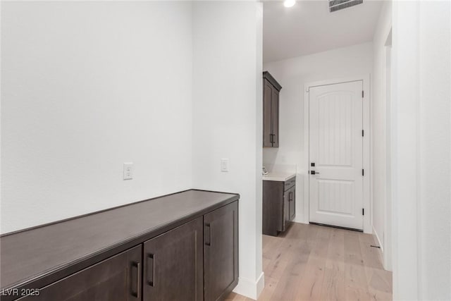hallway featuring light wood-style floors