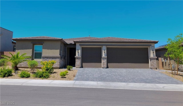 6250 Lamont Hills Ave, Las Vegas, NV 89139 - prairie-style home featuring a garage, stucco siding, decorative driveway, and a tiled roof
