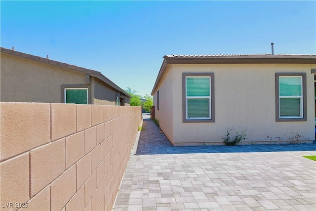 6250 Lamont Hills Ave, Las Vegas, NV 89139 - view of property exterior with a patio and stucco siding