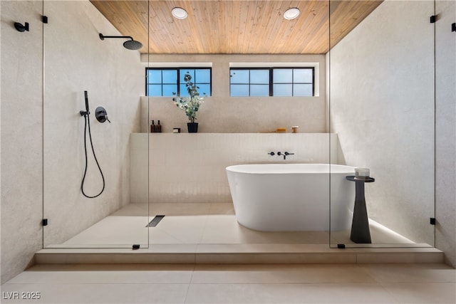full bathroom featuring wood ceiling, a tile shower, healthy amount of natural light, a freestanding bath, and recessed lighting