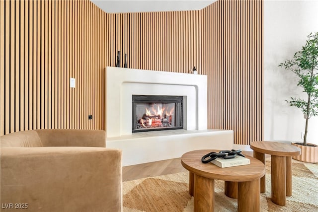 living room with a warm lit fireplace