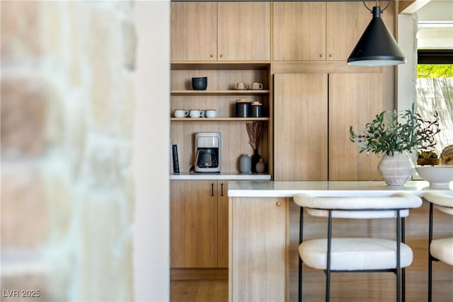 bar with freestanding refrigerator and built in features