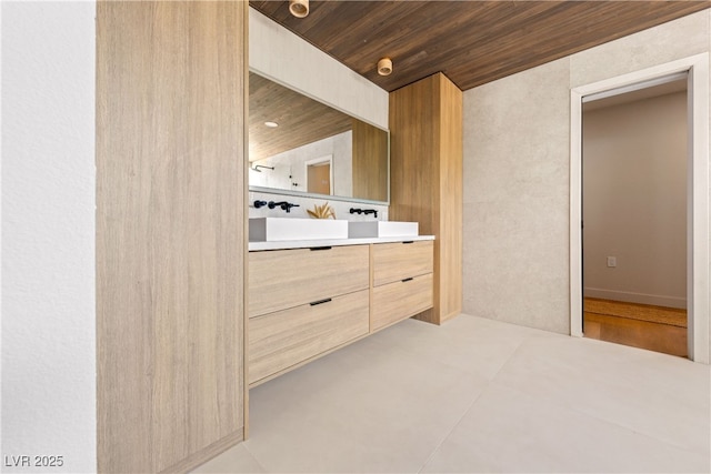 bathroom featuring vanity and wood ceiling