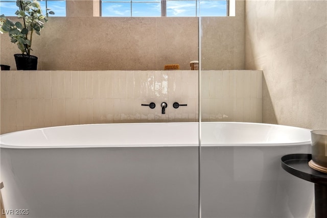 full bathroom with a soaking tub