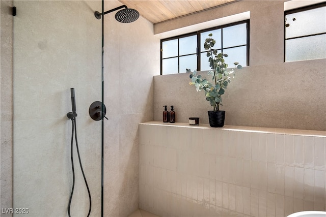 full bath with a tile shower