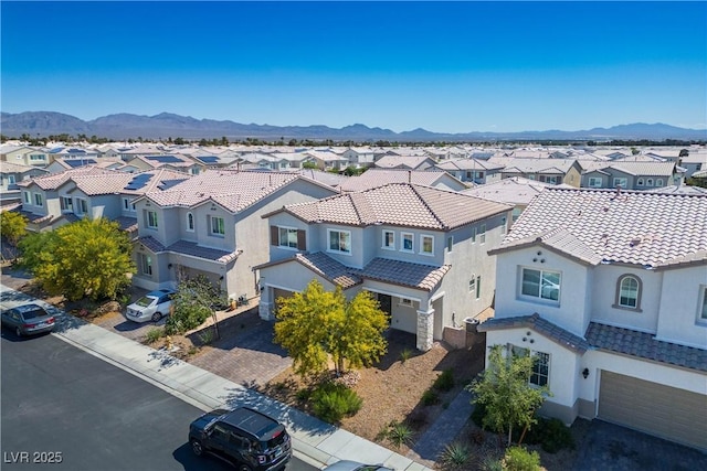 aerial view of residential area with a mountainous background