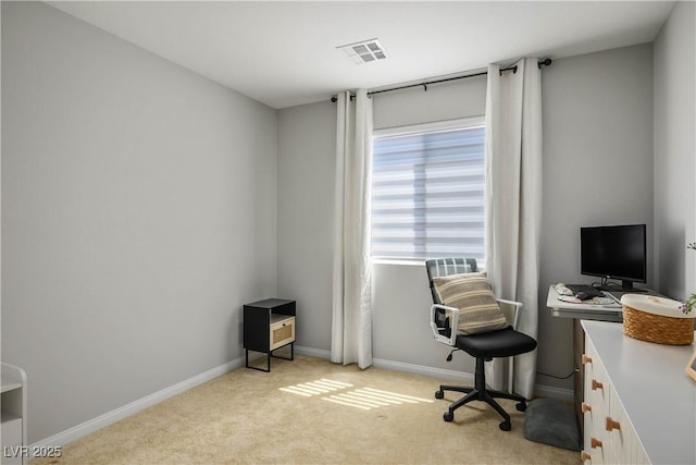 office area with light carpet and baseboards