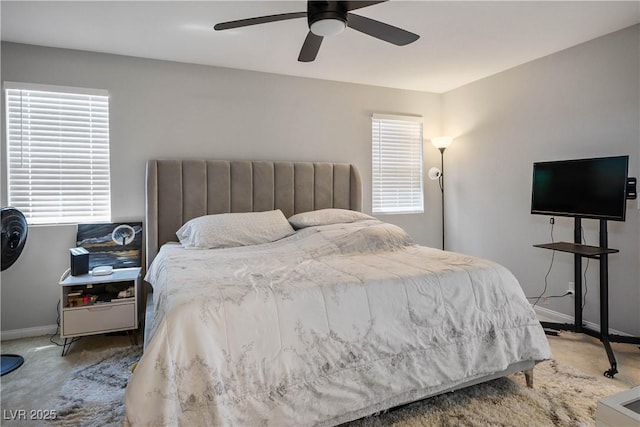 bedroom with baseboards, carpet floors, and ceiling fan