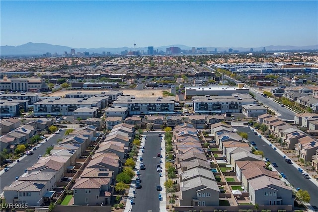 view of urban area with a mountainous background and nearby suburban area