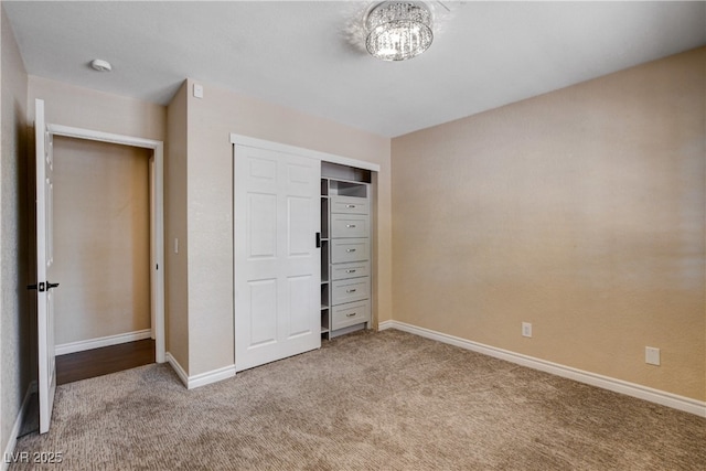 6117 Foxcroft Ave, Las Vegas, NV 89108 - unfurnished bedroom with carpet floors, baseboards, a closet, and a chandelier