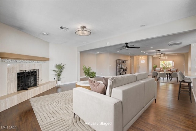 6117 Foxcroft Ave, Las Vegas, NV 89108 - living room featuring ceiling fan, wood finished floors, a tile fireplace, baseboards, and recessed lighting