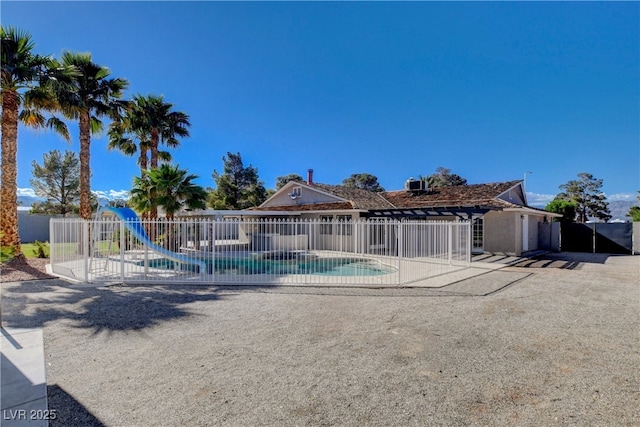 6117 Foxcroft Ave, Las Vegas, NV 89108 - view of pool featuring a water slide, fence, and a patio area