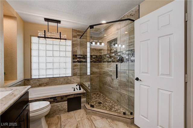 6117 Foxcroft Ave, Las Vegas, NV 89108 - bathroom with a bath, vanity, a stall shower, a textured ceiling, and toilet
