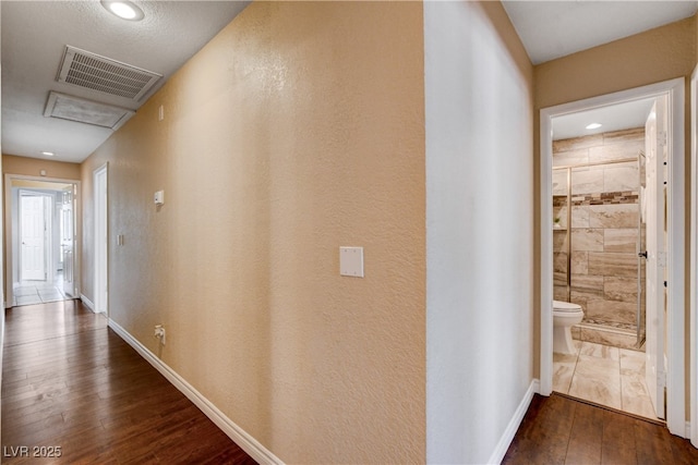 6117 Foxcroft Ave, Las Vegas, NV 89108 - corridor with dark wood finished floors, baseboards, recessed lighting, and attic access