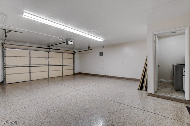 6117 Foxcroft Ave, Las Vegas, NV 89108 - garage with a garage door opener and baseboards