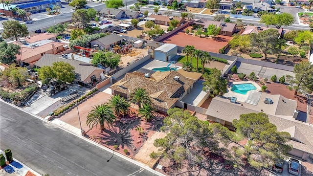 6117 Foxcroft Ave, Las Vegas, NV 89108 - aerial perspective of suburban area with a pool area