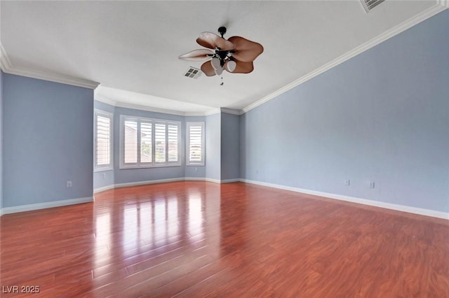 unfurnished room with ceiling fan, wood finished floors, baseboards, and crown molding