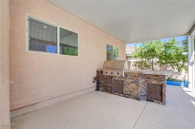 view of patio / terrace featuring exterior kitchen and grilling area
