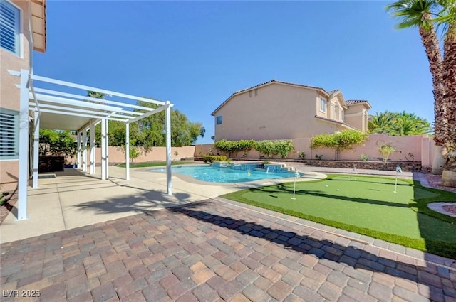 view of swimming pool featuring a putting area, a patio, and a fenced backyard