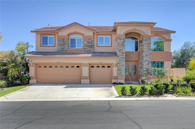 view of front of property featuring stucco siding, a garage, driveway, and stone siding
