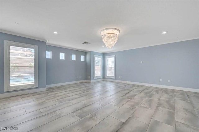 unfurnished room featuring ornamental molding, recessed lighting, baseboards, and a chandelier