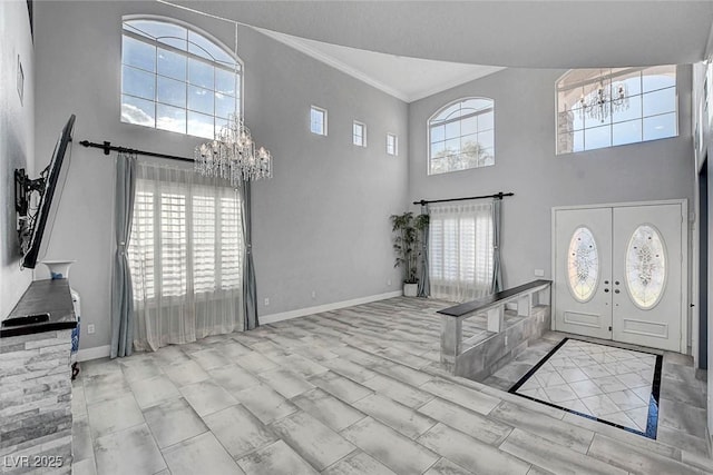281 Powerbilt Ave, Las Vegas, NV 89148 - foyer with a chandelier, ornamental molding, a high ceiling, baseboards, and french doors