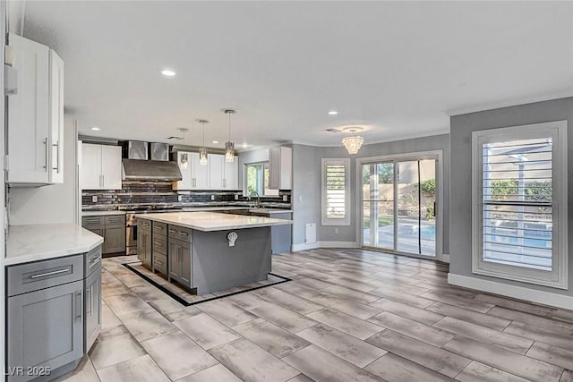 281 Powerbilt Ave, Las Vegas, NV 89148 - kitchen with stainless steel range, gray cabinetry, backsplash, recessed lighting, and baseboards