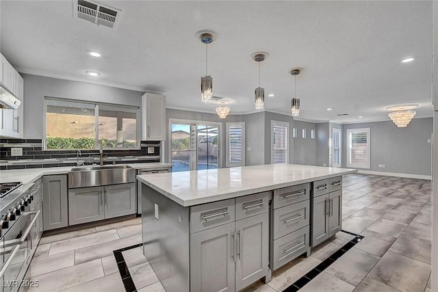 281 Powerbilt Ave, Las Vegas, NV 89148 - kitchen with a sink, gray cabinets, recessed lighting, light countertops, and decorative backsplash