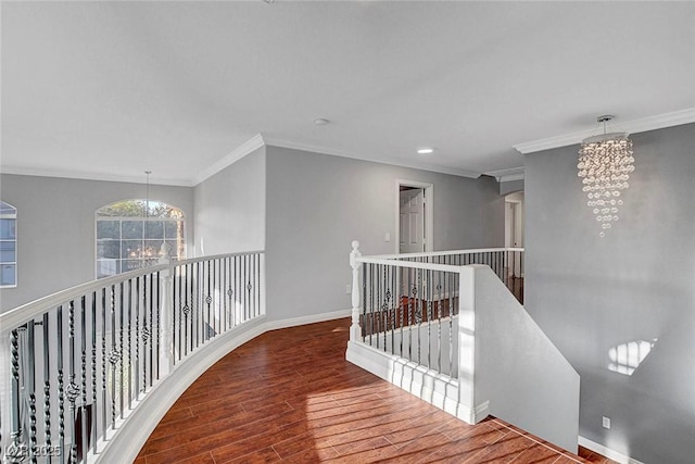 281 Powerbilt Ave, Las Vegas, NV 89148 - corridor with an upstairs landing, a chandelier, wood finished floors, ornamental molding, and baseboards