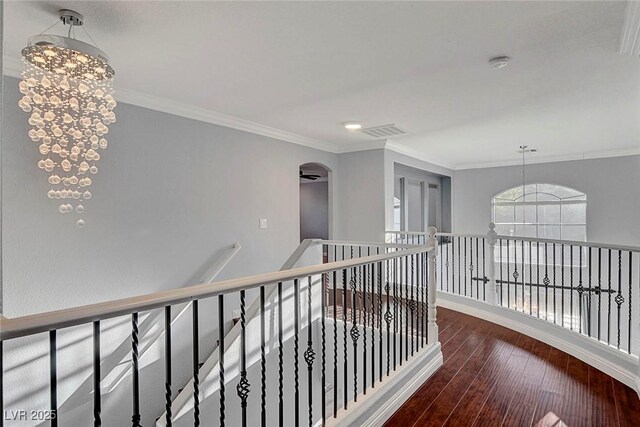 281 Powerbilt Ave, Las Vegas, NV 89148 - corridor featuring hardwood / wood-style flooring, an upstairs landing, a chandelier, crown molding, and baseboards