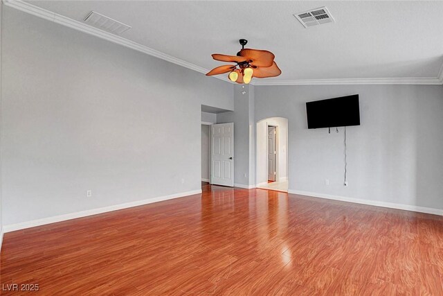 281 Powerbilt Ave, Las Vegas, NV 89148 - spare room with a ceiling fan, arched walkways, ornamental molding, baseboards, and wood finished floors