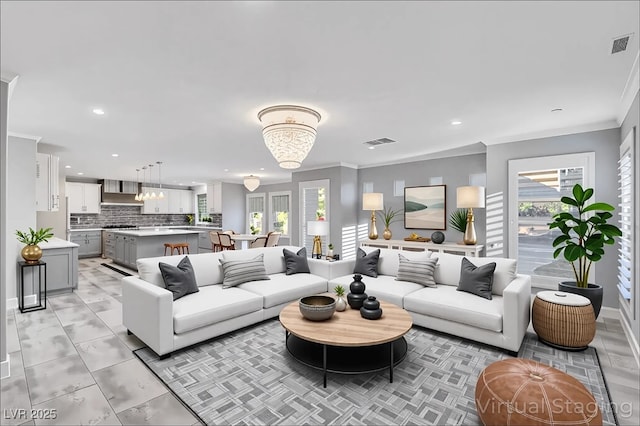 281 Powerbilt Ave, Las Vegas, NV 89148 - living area with plenty of natural light, recessed lighting, crown molding, a chandelier, and baseboards
