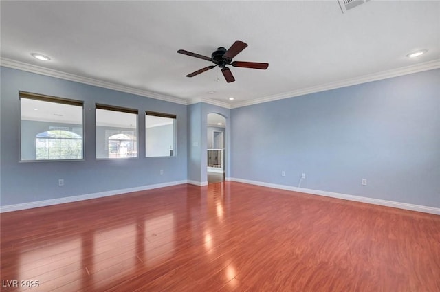281 Powerbilt Ave, Las Vegas, NV 89148 - unfurnished room with arched walkways, wood finished floors, ceiling fan, baseboards, and ornamental molding
