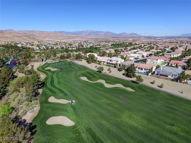 281 Powerbilt Ave, Las Vegas, NV 89148 - aerial overview of property's location with nearby suburban area, a golf course, and a mountainous background