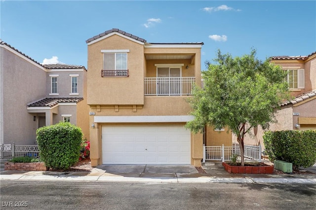 multi unit property with an attached garage, a tile roof, stucco siding, driveway, and a balcony