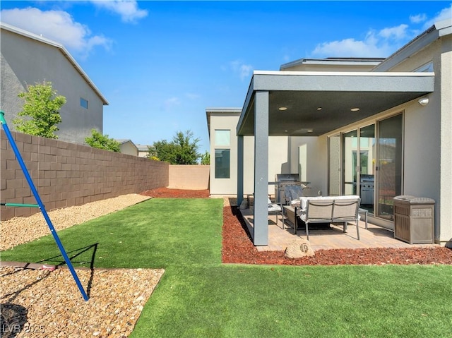 4246 W Landberg Ave, Las Vegas, NV 89141 - view of yard featuring a patio and an outdoor living space