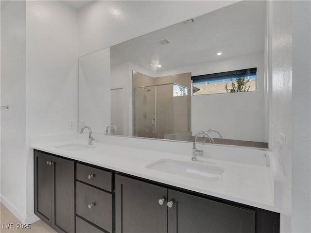 4246 W Landberg Ave, Las Vegas, NV 89141 - full bath featuring a shower stall, double vanity, recessed lighting, and baseboards