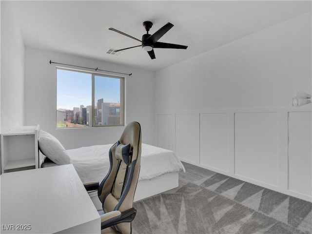 4246 W Landberg Ave, Las Vegas, NV 89141 - bedroom featuring a decorative wall, carpet, ceiling fan, and wainscoting