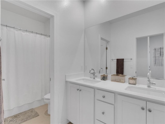 4246 W Landberg Ave, Las Vegas, NV 89141 - bathroom featuring double vanity, toilet, and tile patterned flooring