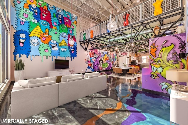 living room featuring a high ceiling