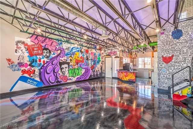 community lobby featuring a towering ceiling