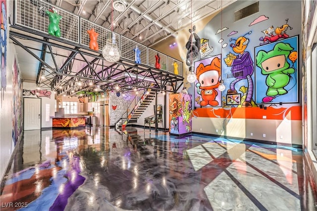 lobby with a high ceiling and stairs