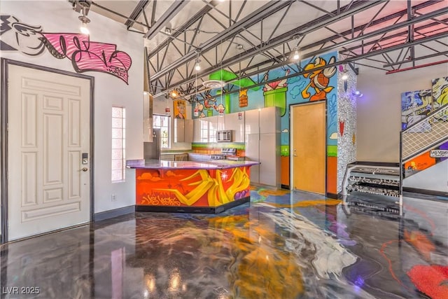 welcome area featuring a towering ceiling