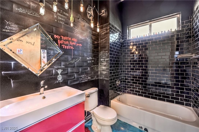 full bath with toilet, vanity, and tub / shower combination