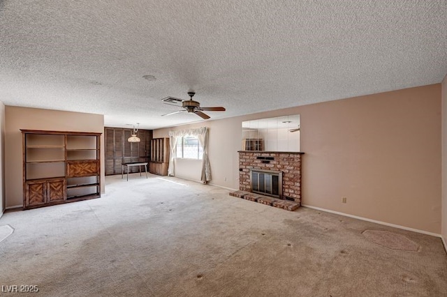 unfurnished living room featuring light carpet, a ceiling fan, a textured ceiling, baseboards, and a fireplace