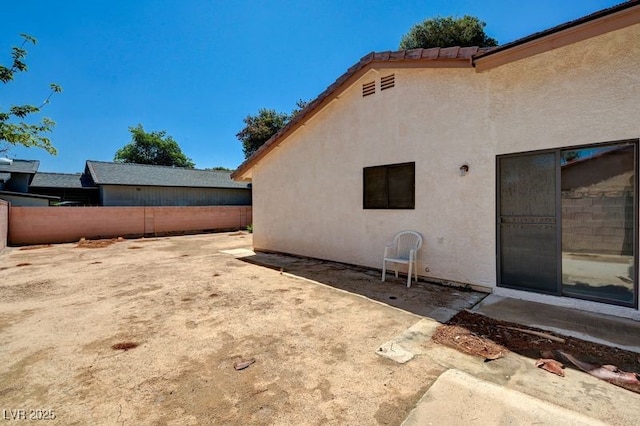 view of yard with fence and a patio area