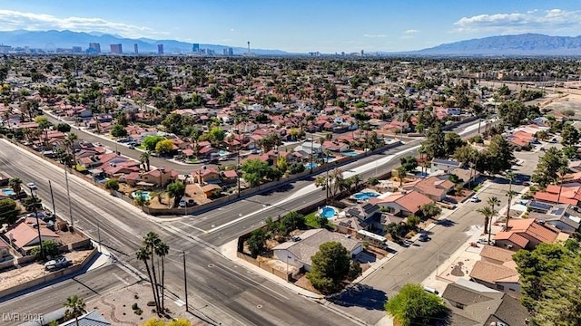 aerial perspective of suburban area with a mountainous background