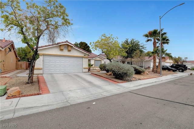 5220 Shasta Daisy St, North Las Vegas, NV 89031 - view of front of home with stucco siding and driveway